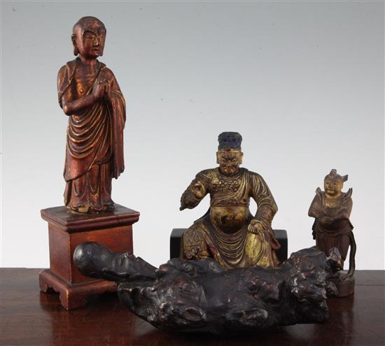 A Chinese gilt lacquered wood seated figure of Guandi, 18th / 19th century, and three other Chinese figures, all with some faults